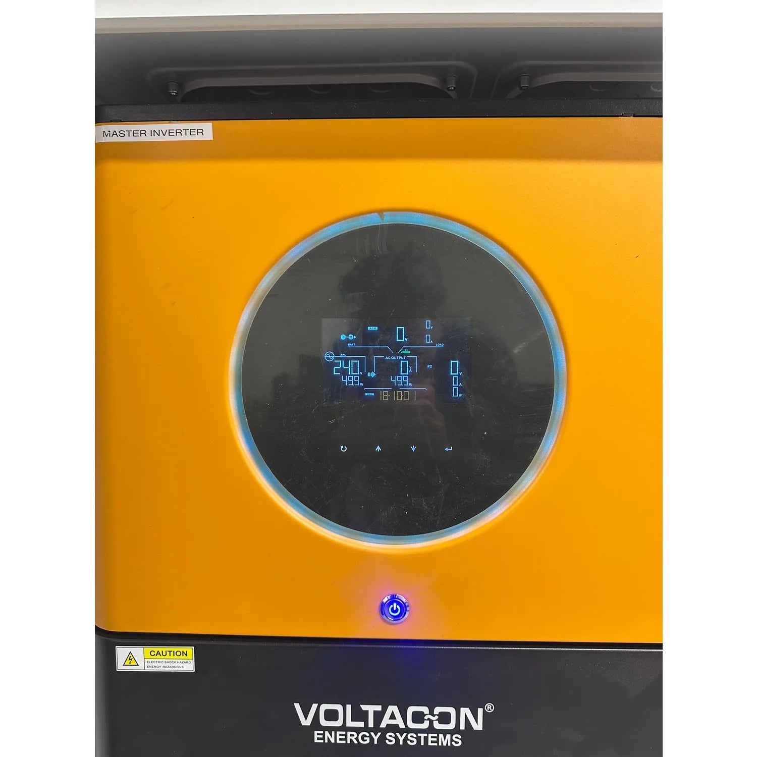 Voltacon Energy Systems Master Inverter control cabinet with circular display showing real-time power data and blue power but