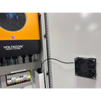 Voltagon Energy Systems solar control cabinet installation with yellow inverter unit, circuit protection panel, and external 