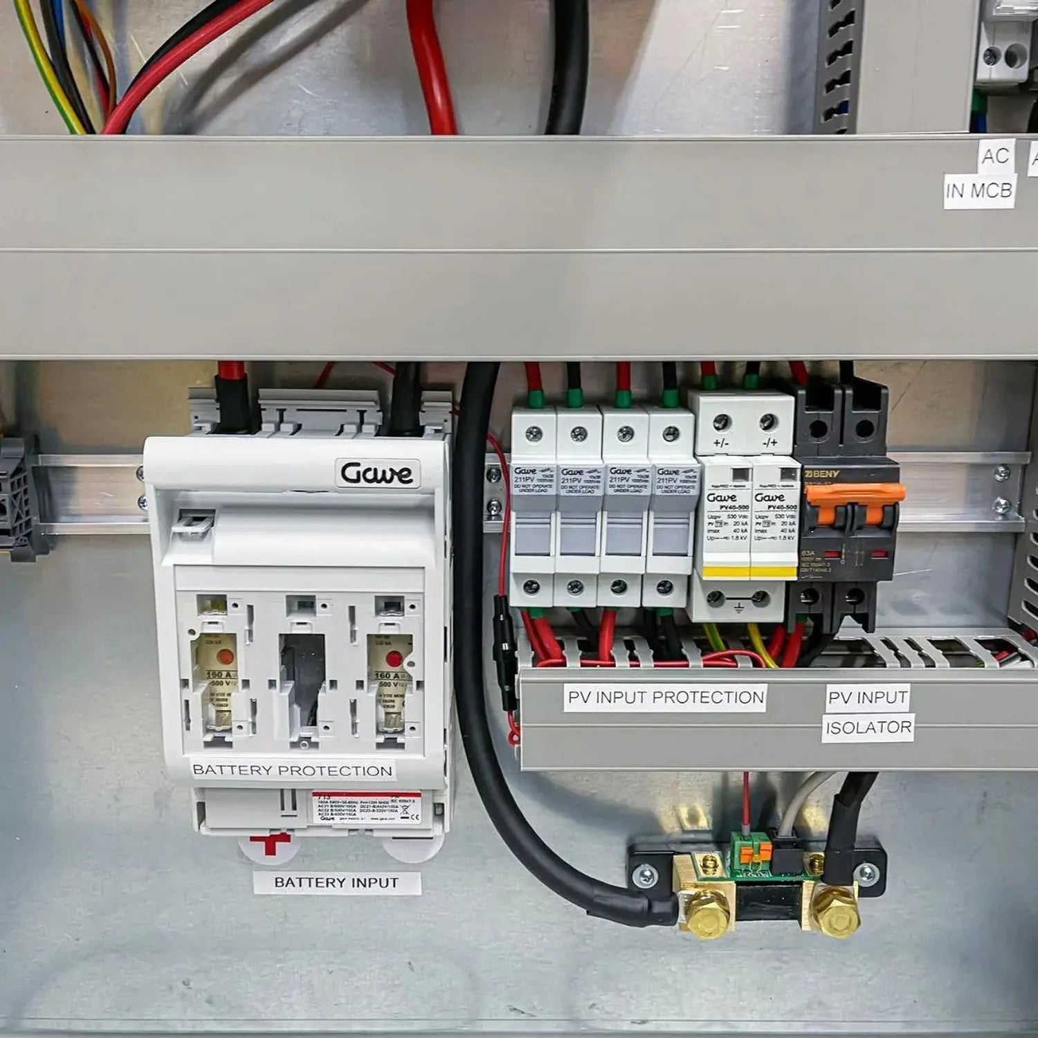 Off-grid inverter cabinet interior showing battery protection module, PV input protection, isolator switch, and circuit break