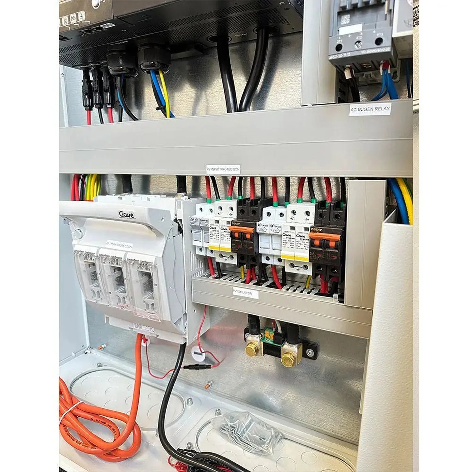 Off-grid solar power cabinet installation showing circuit breakers, wiring, battery protection, and AC inlet relay components