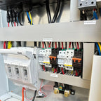 Electrical installation shot showing Conversol MAX III inverter cabinet with battery protection, AC relay, PV isolator, and c