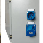 Industrial cabinet showing AC generator/grid inlet socket and AC output/loads socket mounted on white panel, installation sho