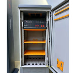 Pylontech US5000 battery enclosure cabinet with open door, showing three orange shelves and control panel with red switches m