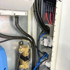 Interior installation view of 33kW power cabinet showing battery terminals, wiring, and control modules with red and blue cab