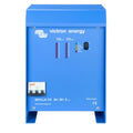 Blue Victron Energy Skylla-TG battery charger with LED indicator lights and toggle switch mounted on front panel.