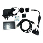 Solar Assistant Monitoring Kit components laid flat: power adapter, cables, interchangeable plugs, USB connector, and metal e