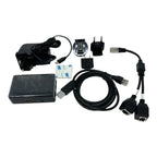 Solar Assistant Monitoring Kit components laid out flat: black box unit, power adapter, USB cables, Ethernet cables, wall plu