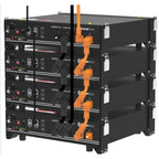Stacked battery system showing four black Pylontech lithium battery units with orange interconnecting cables between them, co