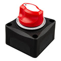 Red and black battery isolator switch with ON/OFF positions and warning label, mounted on black housing with mounting holes.