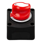 Red and black battery isolator switch with ON/OFF positions and warning text, mounted on black base with four corner holes.