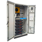 Open electrical enclosure showing Voltacon power cabinet with yellow transformer, control modules, five stacked UPS5000 units