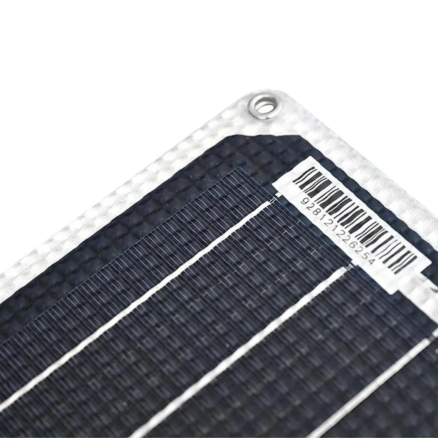 Close-up of flexible solar panel corner showing black monocrystalline cells with white frame and barcode label.