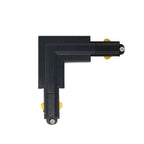 Black L-shaped track connector with brass contact points, shown as product isolated on white background.